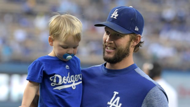 Aug 20, 2018; Los Angeles, CA, USA; Los Angeles Dodgers starting pitcher Clayton Kershaw holds his son Charley Kershaw before the game against the St. Louis Cardinals at Dodger Stadium.The Cardinals defeated the Dodgers 5-3. Mandatory Credit: Kirby Lee-USA TODAY Sports